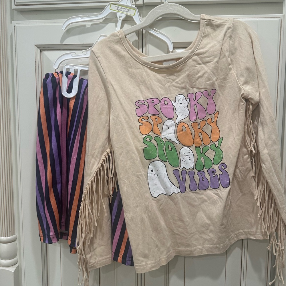 Spooky Vibes Halloween Fringe Top and Striped Skirt.